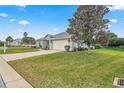 Single-story home with a landscaped yard and attached garage at 5908 Nw 24Th St, Ocala, FL 34482