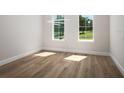 Bright office features hardwood floors and large windows at 7647 Nw 33Rd Pl, Ocala, FL 34482