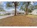 Single-story home nestled in a tree-lined neighborhood at 8851 Sw 92Nd Pl # E, Ocala, FL 34481