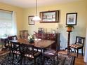 Formal dining room with elegant furniture and hardwood floors at 1040 Se 9Th Ave, Ocala, FL 34471