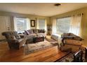 Bright living room featuring hardwood floors and ample natural light at 1040 Se 9Th Ave, Ocala, FL 34471