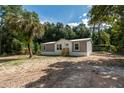 Mobile home with palm tree and spacious yard at 1143 Se 159Th Ct, Silver Springs, FL 34488