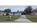 Ranch style home with solar panels and carport at 137 Marion Oaks Ln, Ocala, FL 34473