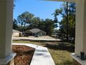 Landscaped front yard with a walkway leading to the house at 14268 Se 27Th Ct, Summerfield, FL 34491