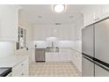 Modern kitchen with stainless steel appliances and white shaker cabinets at 1728 Se 8Th St, Ocala, FL 34471