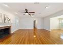 Bright living room with hardwood floors, fireplace, and ample natural light at 1728 Se 8Th St, Ocala, FL 34471