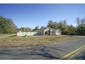 Single-story house with a two-car garage and a large fenced yard at 201 Emerald Loop Pass, Ocala, FL 34472