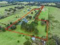 Aerial view showing property boundaries of expansive estate at 20921 Sw 36Th St, Dunnellon, FL 34431