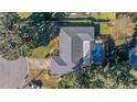 Bird's-eye view of a house with a pool and surrounding trees at 2575 Se 34Th St, Ocala, FL 34471