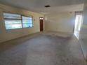 Spacious living room with neutral carpeting at 36904 Ridge Rd, Fruitland Park, FL 34731