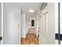 Bright entryway with wood floors leading to living room at 3827 Ne 17Th Street Cir, Ocala, FL 34470