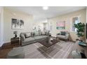 Living room with hardwood floors and staged furniture at 7000 Sw 129Th Pl, Ocala, FL 34473