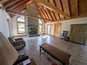 Spacious living area with stone fireplace and high ceilings at 9100 Se 180Th Avenue Rd, Ocklawaha, FL 32179