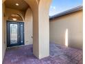 Covered entryway with arched details and a glass-paned front door at 10384 Sw 41St Ave, Ocala, FL 34476