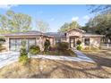 Single-story home with a two-car garage and carport at 13775 Sw 115Th Pl, Dunnellon, FL 34432