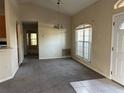 Bright dining room with large windows and carpet flooring at 16025 Sw 25Th Ter, Ocala, FL 34473