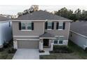 Attractive two-story home with well-manicured landscaping and an attached two car garage at 5429 Sw 44Th Court Rd, Ocala, FL 34474