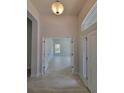 Welcoming entryway with light tile floors leading to a bright living area at 6915 Sw 152Nd St, Ocala, FL 34473