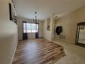 Bright dining area with wood-look flooring and chandelier at 7375 Sw 106Th St, Ocala, FL 34476