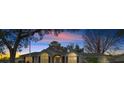 House exterior at dusk showcasing architectural details and landscaping at 8597 Sw 108Th Lane Rd, Ocala, FL 34481