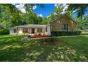 Stone and white exterior with a welcoming front porch at 8930 Sw 8Th St, Ocala, FL 34481