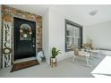 Inviting front porch with rocking chairs and a welcoming wreath at 8930 Sw 8Th St, Ocala, FL 34481