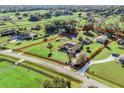 Aerial view showing a house on a spacious lot with surrounding green fields at 9270 Sw 9Th Ter, Ocala, FL 34476