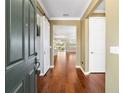 Hardwood floors and barn door leading into living area at 9840 Sw 90Th St, Ocala, FL 34481