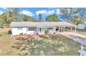 Single-story home with carport and spacious yard at 9981 Sw 101St Pl, Ocala, FL 34481