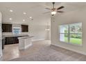 Spacious kitchen with an island and dark brown cabinets at 3168 Ne 46Th Ave, Ocala, FL 34470