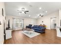 Spacious living area with hardwood floors and ceiling fans at 3707 Se 24Th St, Ocala, FL 34471