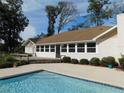 Inviting pool area adjacent to home's back at 4960 Se 17Th St, Ocala, FL 34471