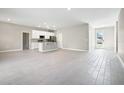 Open-concept living area with kitchen and dining space at 5789 Sw 129Th Place Rd, Ocala, FL 34473