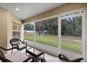 Relaxing screened porch overlooking backyard at 6303 Sw 116Th Street Rd, Ocala, FL 34476