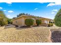 Side view of a charming house with a well-manicured rock garden at 8125 Sw 81St Loop, Ocala, FL 34476