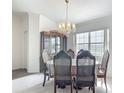 Elegant dining room featuring a chandelier, window, and classic furnishings at 8574 Sw 60Th Ct, Ocala, FL 34476