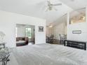 Bright living area with high ceilings, hardwood floors, ceiling fans, and an open floor plan at 8574 Sw 60Th Ct, Ocala, FL 34476