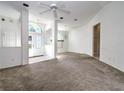 Spacious living room with high ceilings and carpet at 10043 Sw 202Nd Cir, Dunnellon, FL 34431