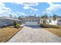 Beautiful home with a wide driveway and a well-manicured lawn at 10322 Sw 99Th Ln, Ocala, FL 34481