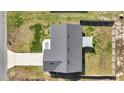 Aerial view of the house showing the driveway and fenced backyard with sunshade at 13787 Sw 43Rd Cir, Ocala, FL 34473