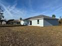 Rear view of the house, showcasing backyard space at 15801 Sw 37Th Cir, Ocala, FL 34473