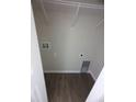 Simple laundry room with vinyl flooring and overhead shelving at 2792 Sw 161St Loop, Ocala, FL 34473