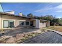 Tan house with covered patio and walkway at 3261 Se 41St Pl, Ocala, FL 34480