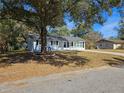 Cute ranch home with mature trees and a spacious yard at 3333 Se 12Th St, Ocala, FL 34471