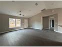 Bright living room featuring hardwood floors and high ceilings at 3941 Se 137Th Ln, Summerfield, FL 34491