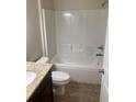 Clean bathroom with tub, toilet and granite countertop at 40 Juniper Trl, Ocala, FL 34480