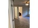 Spacious bedroom with ensuite bathroom and wood-look flooring at 40 Juniper Trl, Ocala, FL 34480