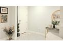 Bright and airy entryway with a console table and decorative accents at 4321 Sw 52Nd Lane Rd, Ocala, FL 34474