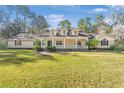 House exterior showcasing a classic design and landscaping at 5000 Se 11Th Ave, Ocala, FL 34480