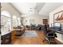 Spacious living room with hardwood floors, vaulted ceiling and ample natural light at 5137 Nw 20Th Pl, Ocala, FL 34482